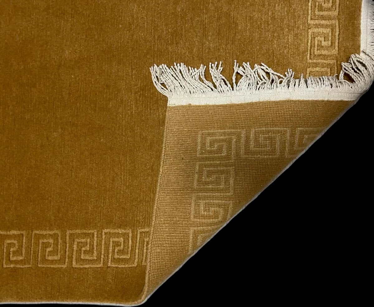 Nepali rug of Tibetan style in dimensions 166 centimeters length by 94 centimeters width with mainly yellow colors — Folded