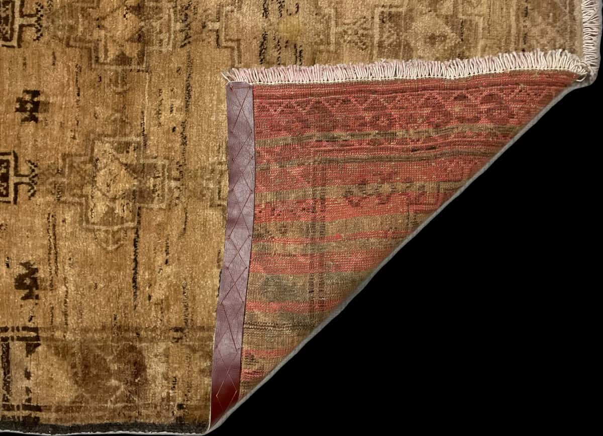 Persian rug of Baluch style in dimensions 220 centimeters length by 117 centimeters width with mainly brown colors — Folded