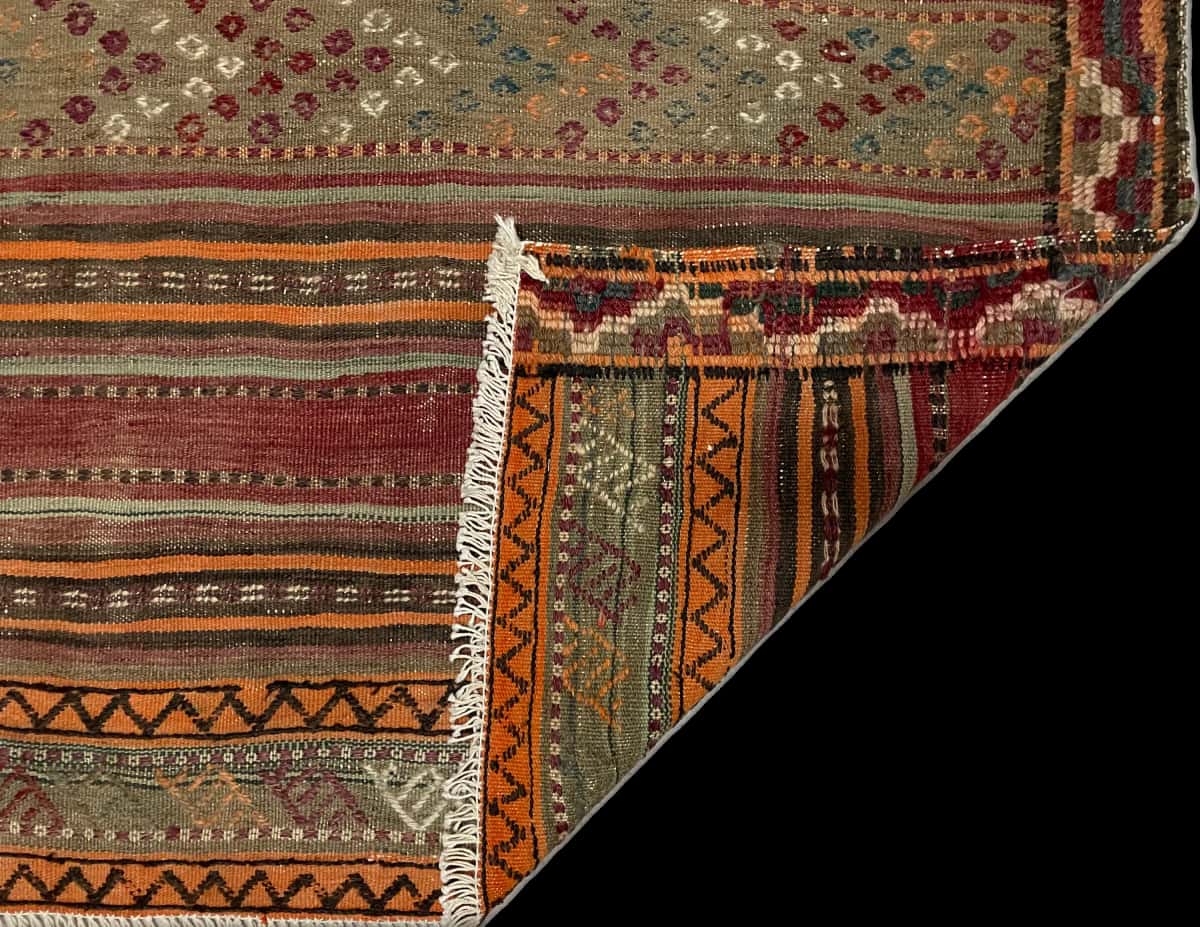 Persian rug of Sumak style in dimensions 129 centimeters length by 123 centimeters width with mainly brown and green colors — Folded