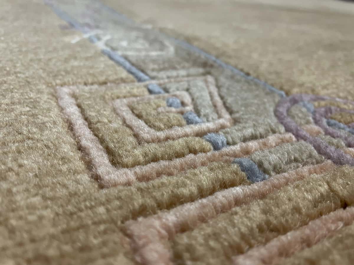 Nepali rug of Tibetan style in dimensions 247 centimeters length by 200 centimeters width with mainly yellow colors — Texture close-up