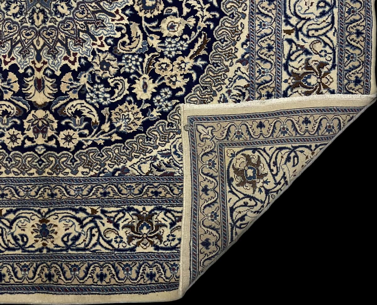 Persian rug of Nain style in dimensions 208 centimeters length by 198 centimeters width with mainly beige and blue colors — Folded