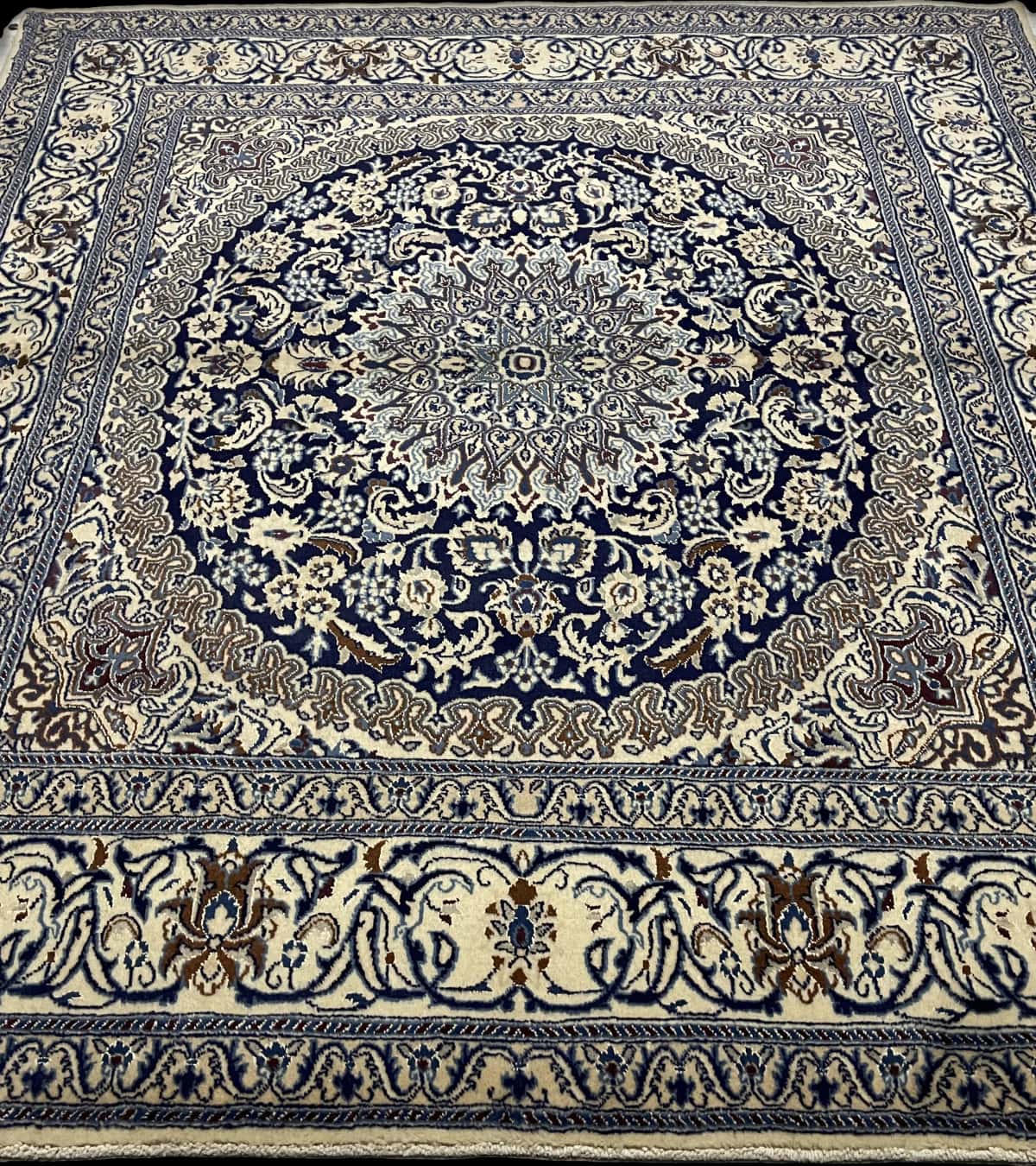 Persian rug of Nain style in dimensions 208 centimeters length by 198 centimeters width with mainly beige and blue colors — Perspective
