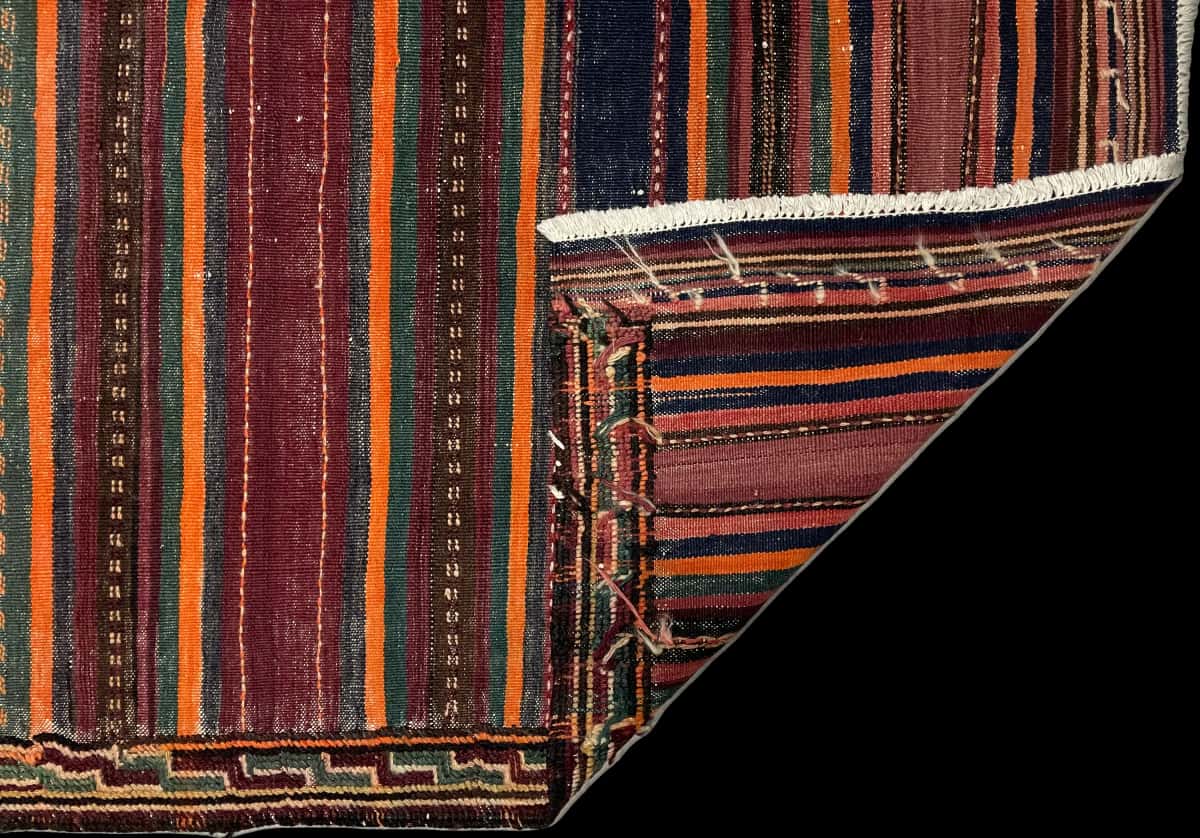 Persian rug of Sumak style in dimensions 152 centimeters length by 135 centimeters width with mainly purple and orange colors — Folded