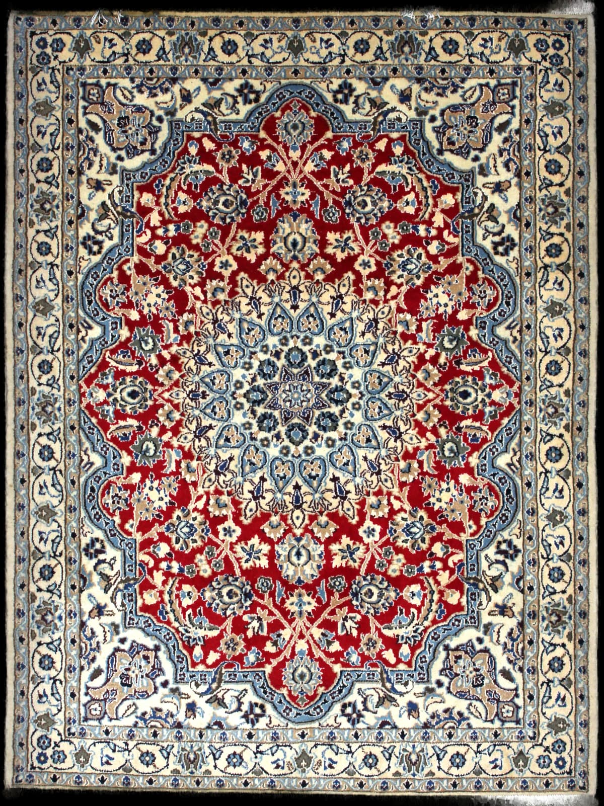 Persian rug of Nain style in dimensions 196 centimeters length by 148 centimeters width with mainly red colors