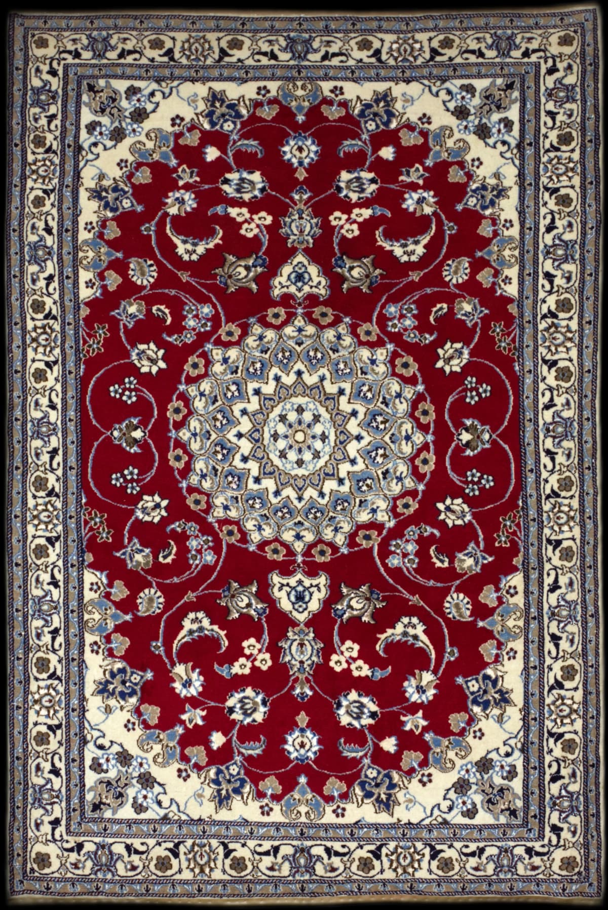 Persian rug in dimensions 262 centimeters length by 160 centimeters width with mainly red colors