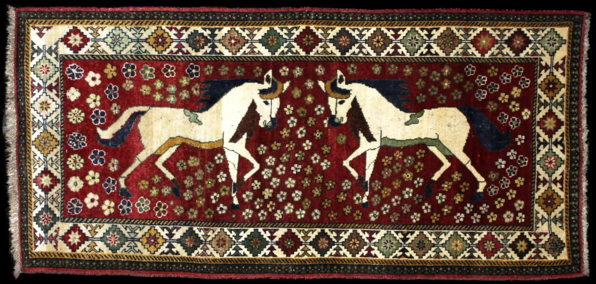 Persian rug of Gabbeh style in dimensions 203 centimeters length by 96 centimeters width with mainly red colors