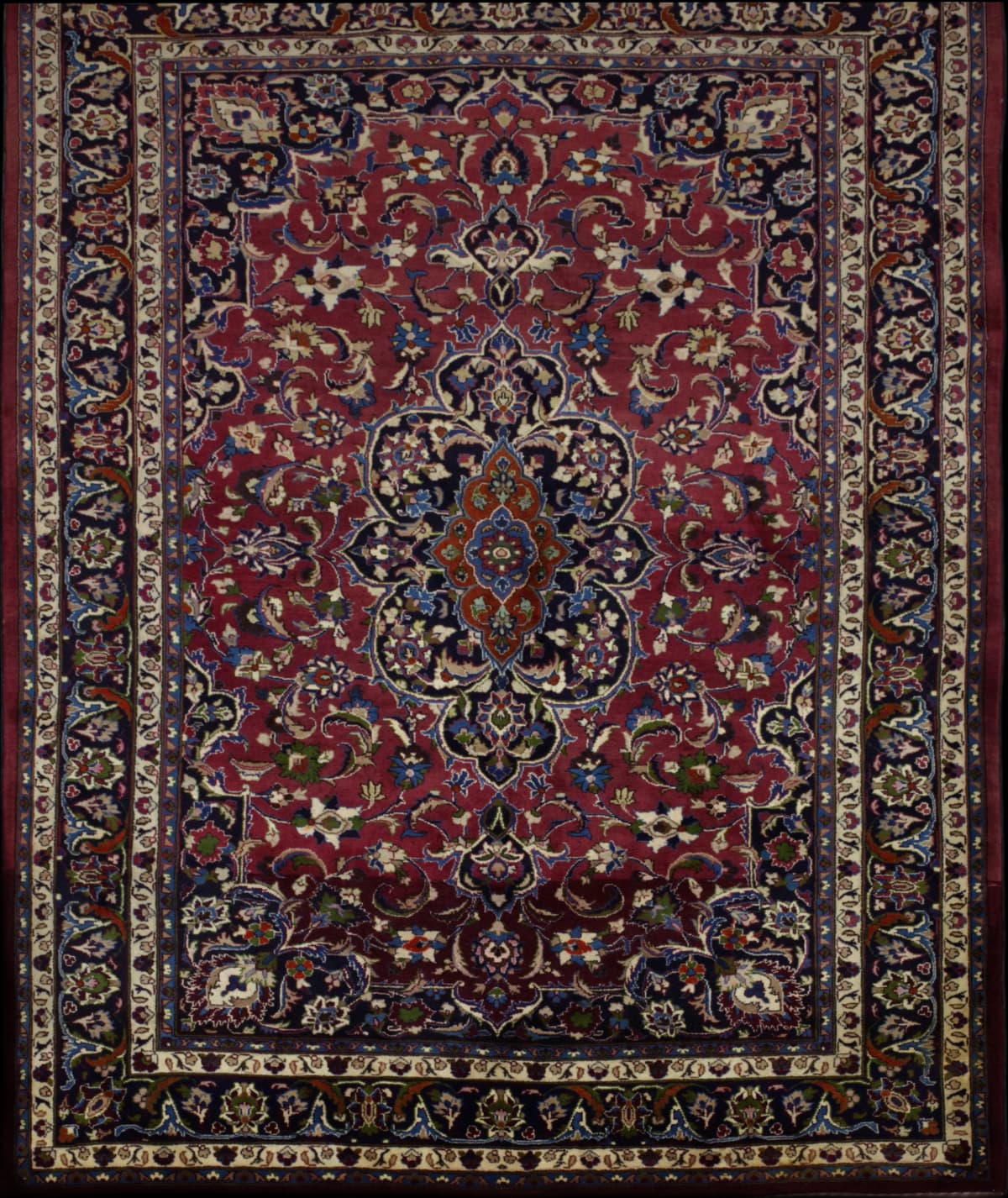Persian rug in dimensions 300 centimeters length by 210 centimeters width with mainly red colors