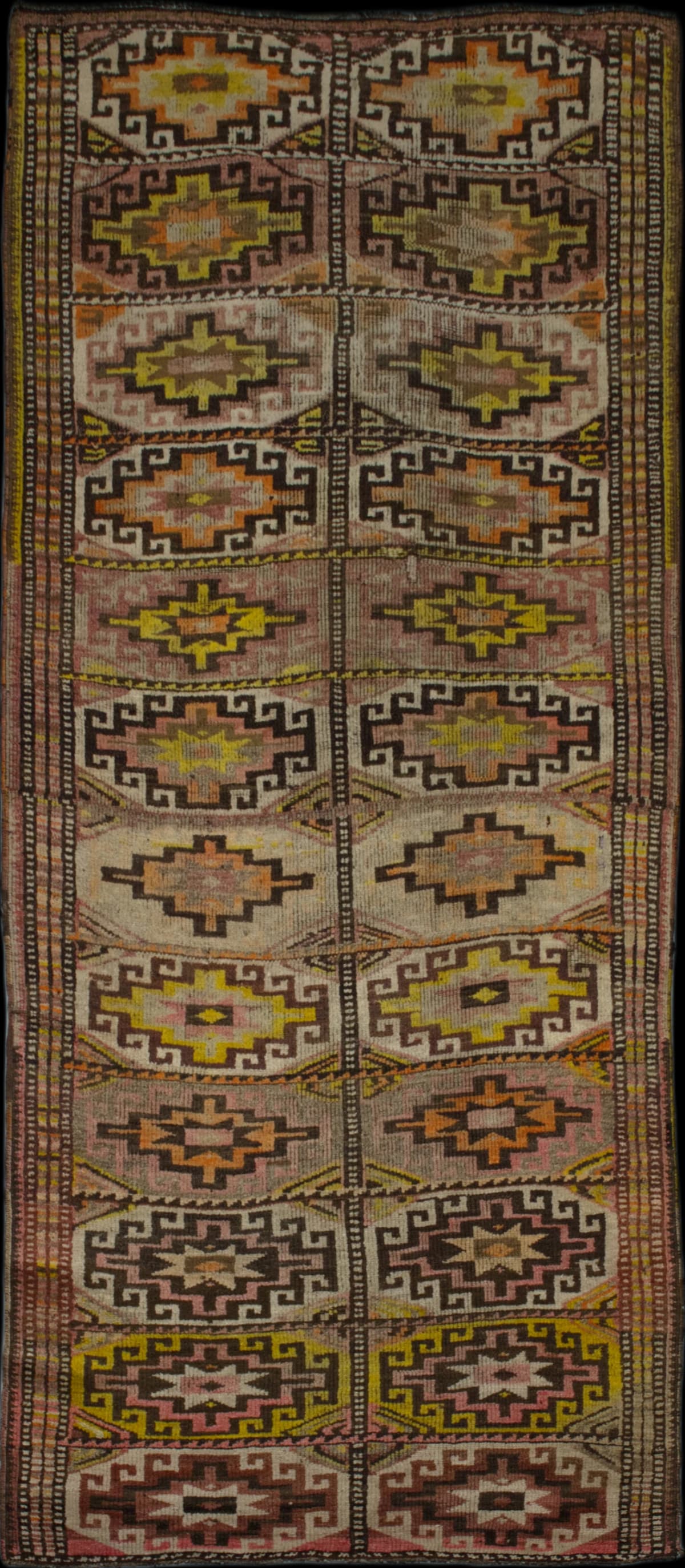 Persian rug in dimensions 306 centimeters length by 123 centimeters width with mainly brown and yellow colors