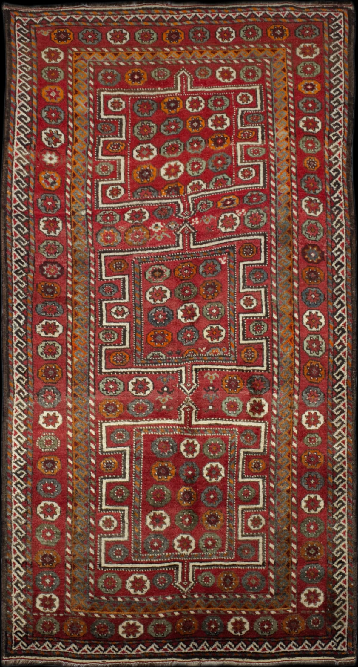 Persian rug in dimensions 250 centimeters length by 126 centimeters width with mainly red colors