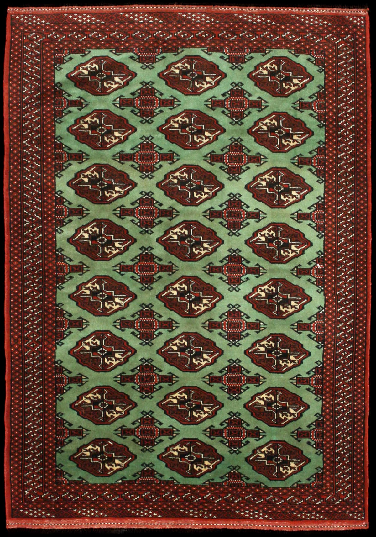 alfombra persa de estilo turcomana en dimensiones 188 centímetros de largo por 130 centímetros de ancho con colores principalmente verde