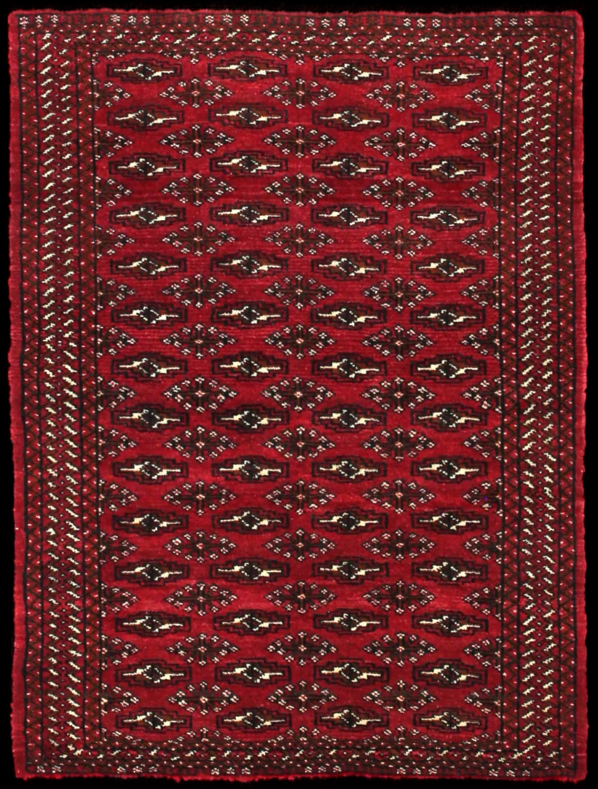 Persian rug of Turkoman style in dimensions 110 centimeters length by 83 centimeters width with mainly red colors