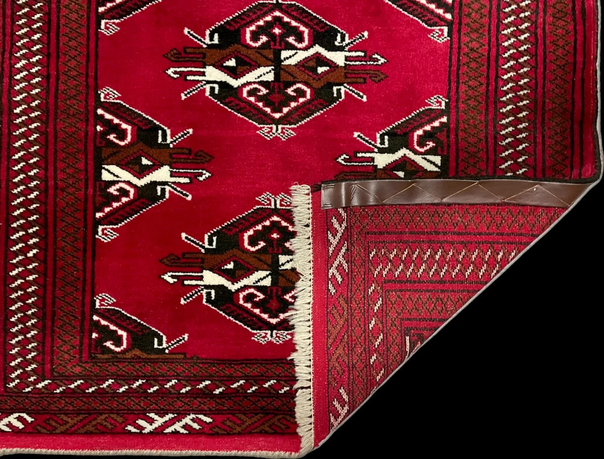 Perserteppich Turkmene, orientalisch, 98x150 cm, überwiegend in Rot — Gefaltet