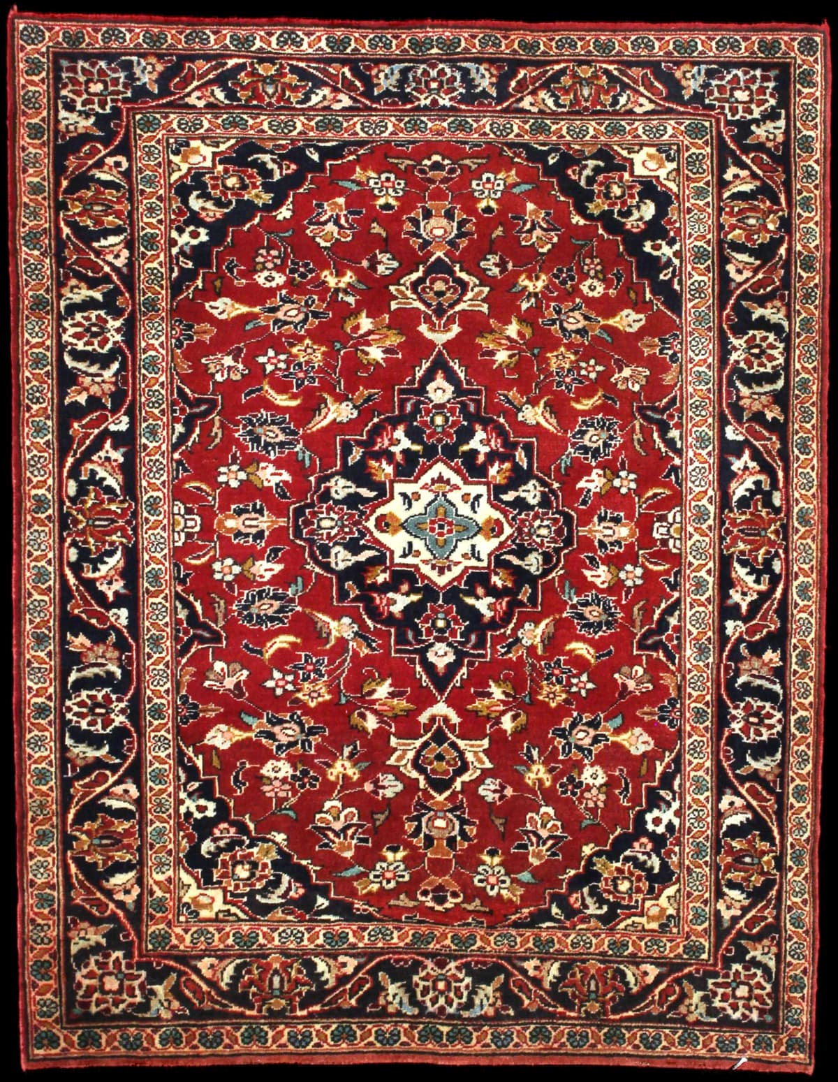 Persian rug of Kashan style in dimensions 143 centimeters length by 111 centimeters width with mainly red colors