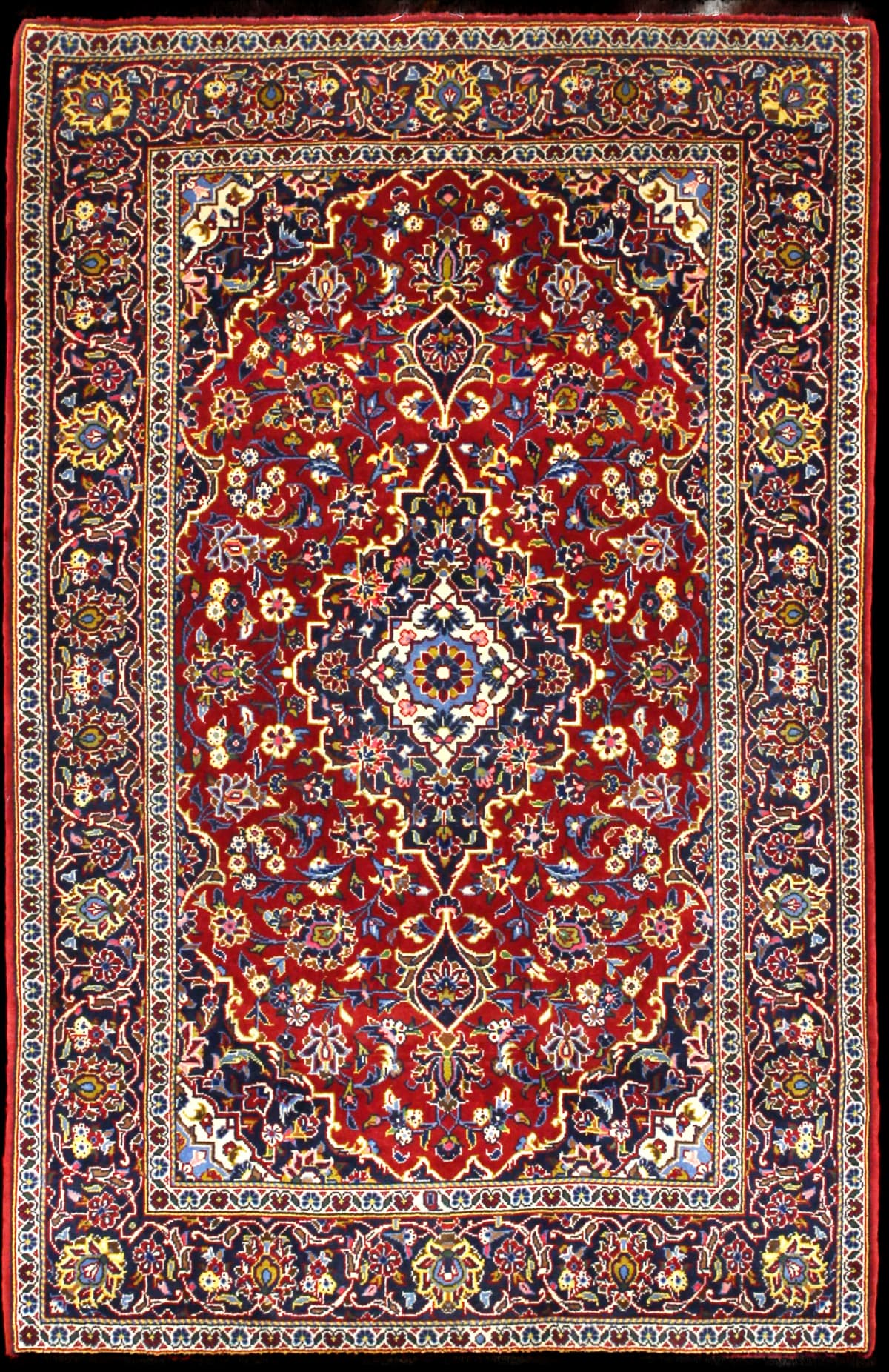 Persian rug of Kashan style in dimensions 164 centimeters length by 105 centimeters width with mainly red and blue colors