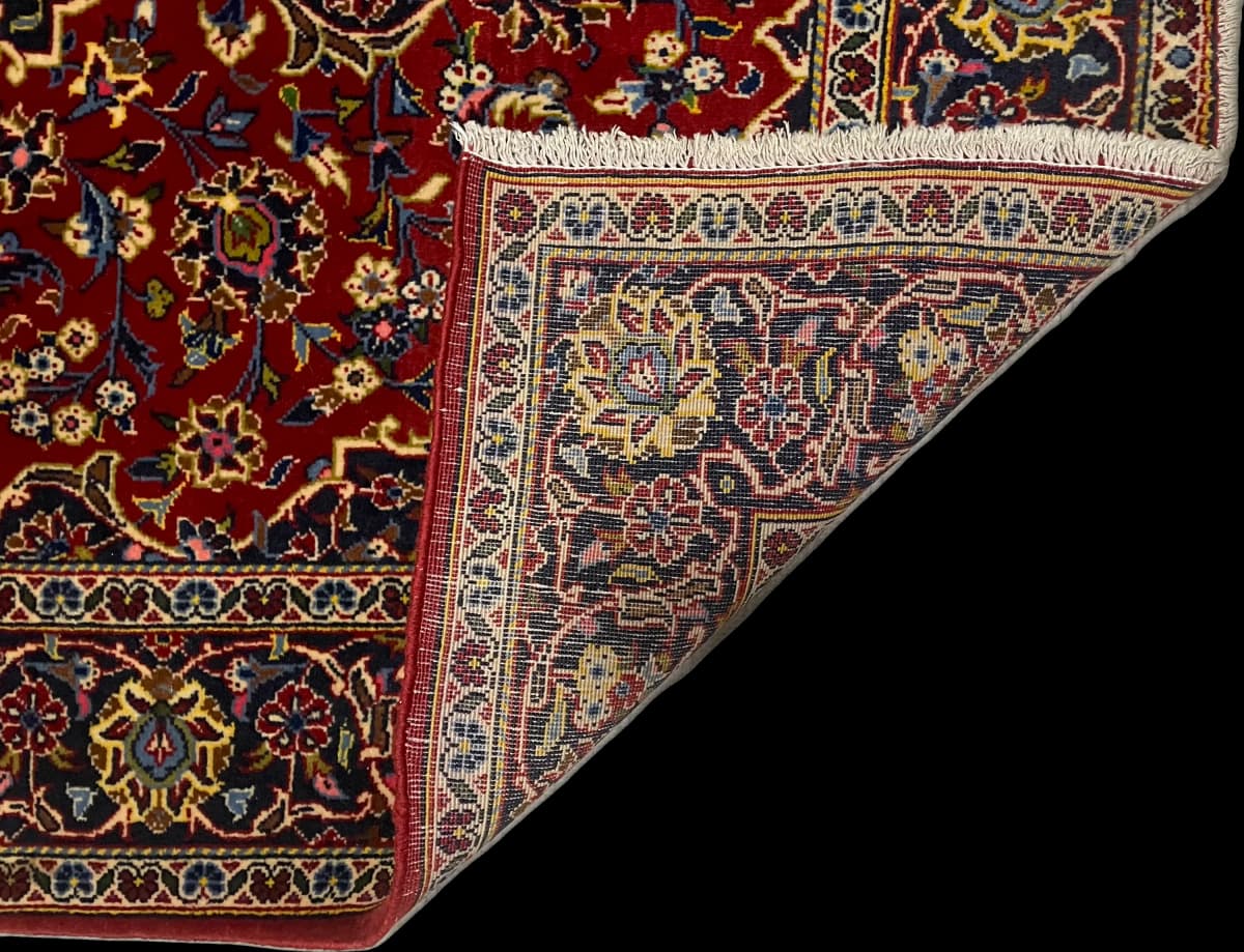Perserteppich Kashan, orientalisch, 105x164 cm, überwiegend in Rot — Gefaltet