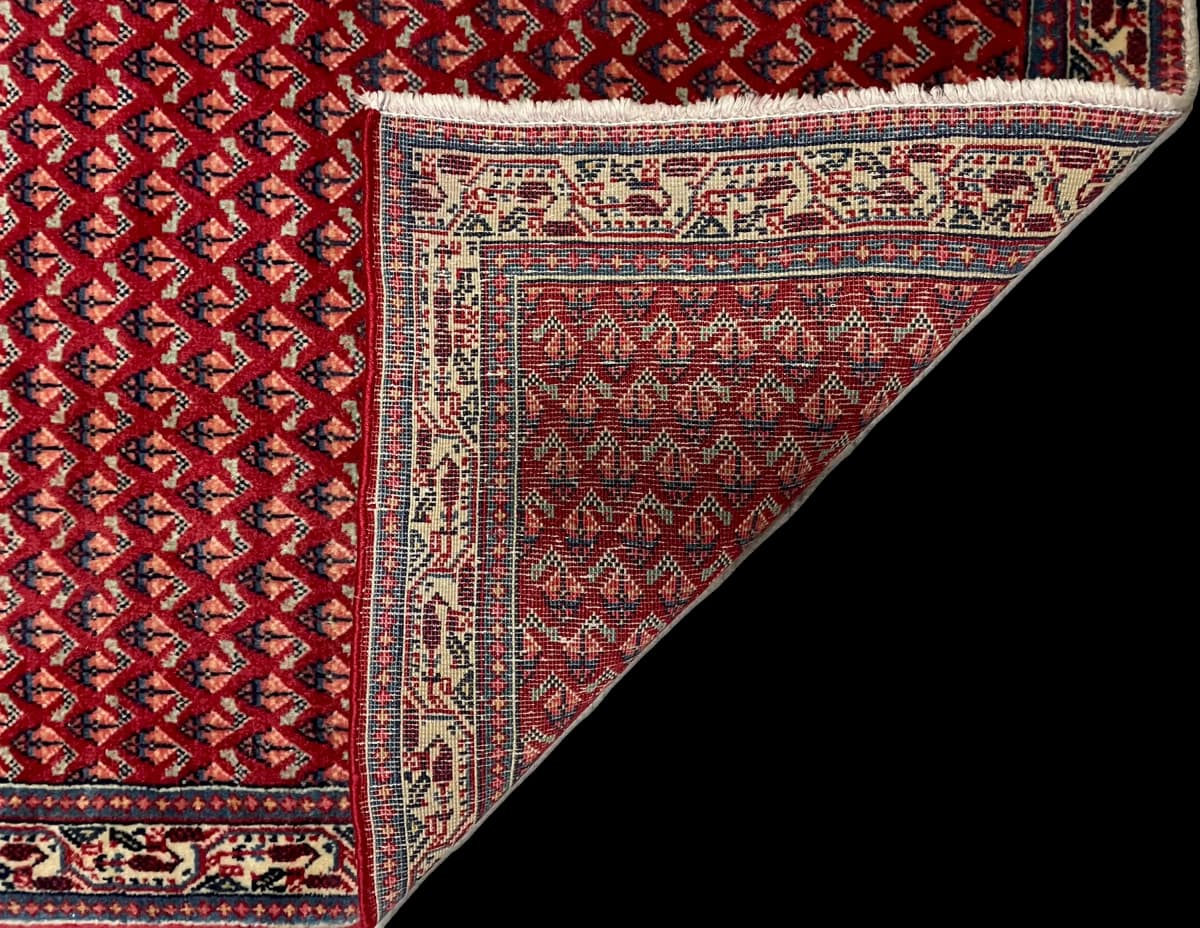 Perserteppich Arak, orientalisch, 67x115 cm, überwiegend in Rot — Gefaltet