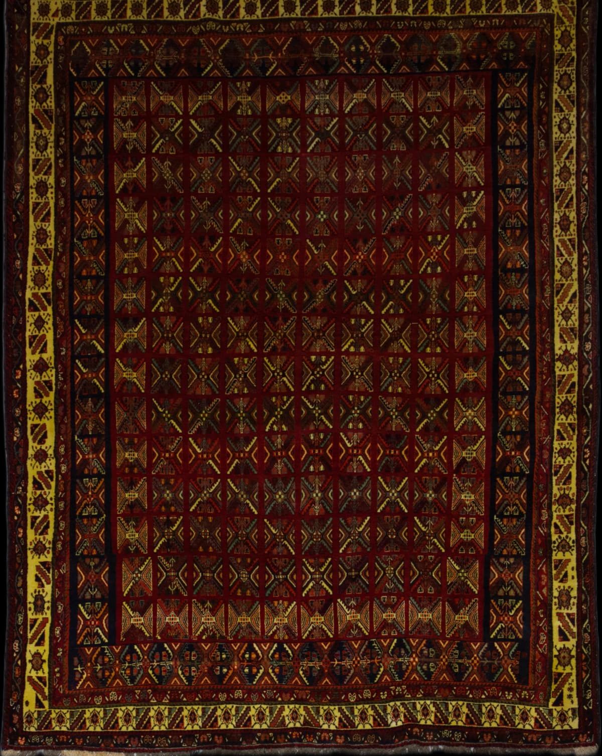Persian rug in dimensions 305 centimeters length by 205 centimeters width with mainly red colors