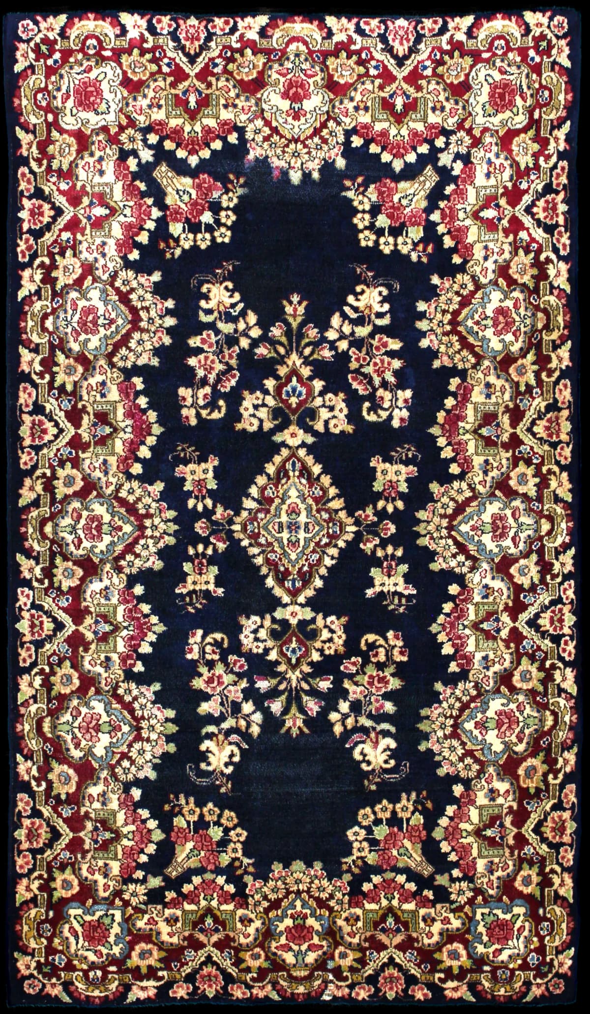 Persian rug of Kerman style in dimensions 217 centimeters length by 123 centimeters width with mainly red and blue colors