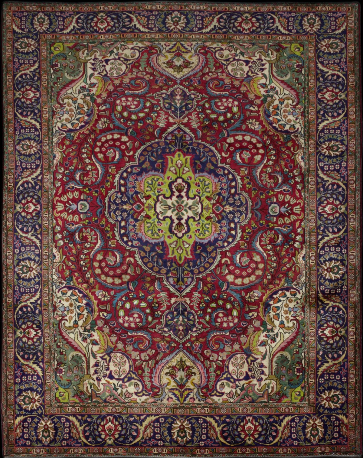 Persian rug in dimensions 285 centimeters length by 203 centimeters width with mainly red colors