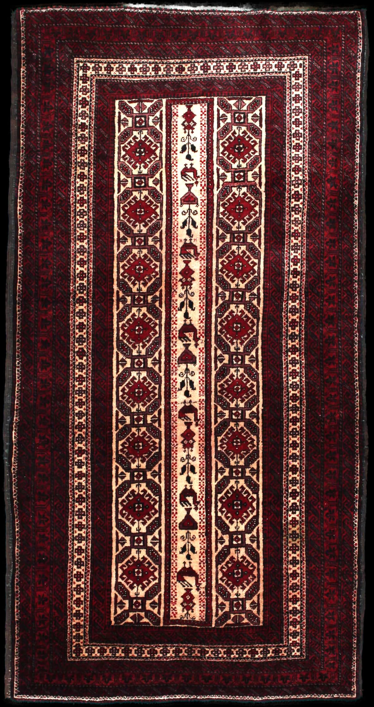 Persian rug of Baluch style in dimensions 205 centimeters length by 108 centimeters width with mainly red colors