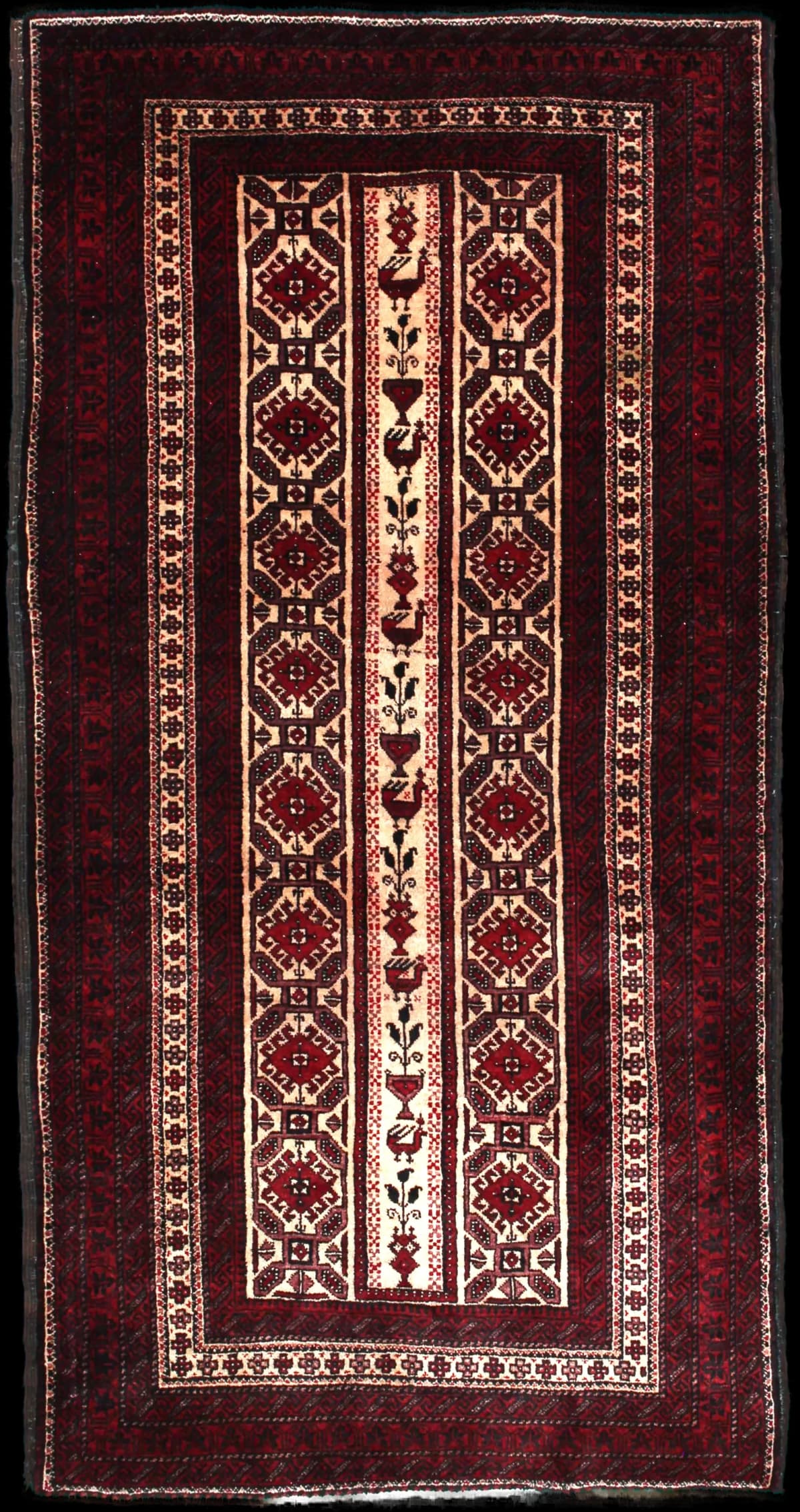 Persian rug of Baluch style in dimensions 205 centimeters length by 108 centimeters width with mainly red colors