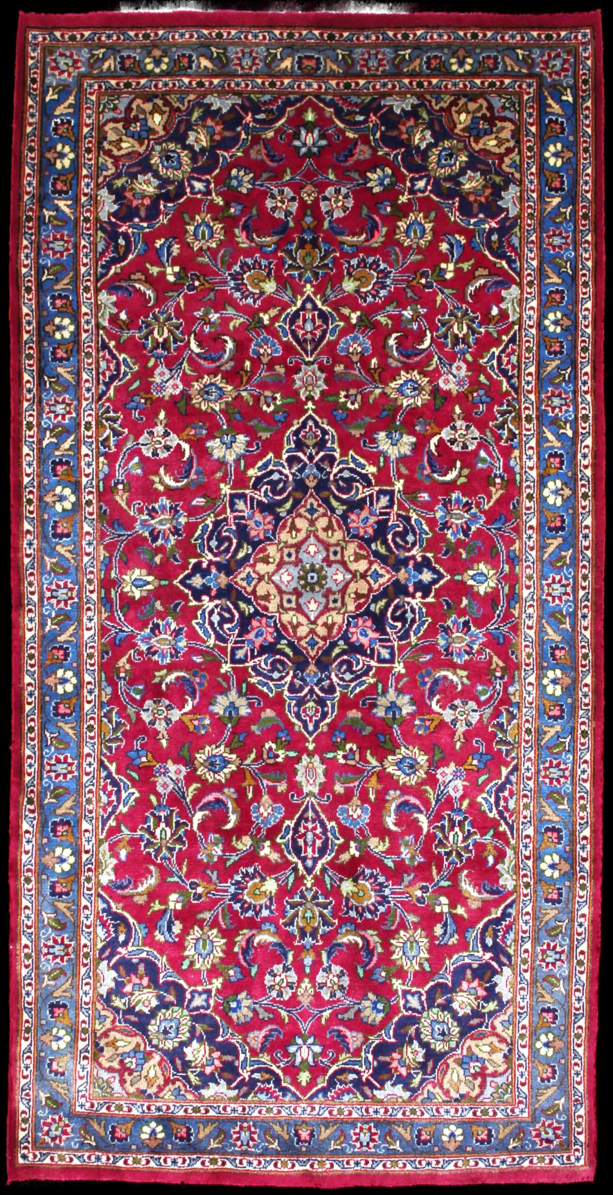 Persian rug of Kashmar style in dimensions 217 centimeters length by 110 centimeters width with mainly red and blue colors