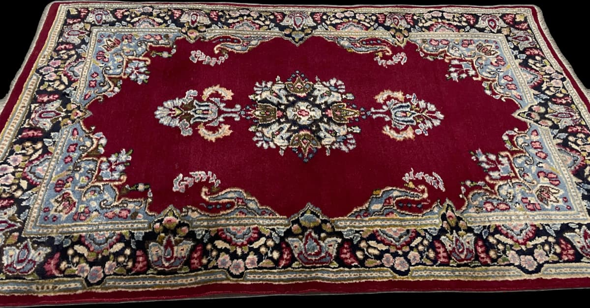 Perserteppich Kerman, orientalisch, 88x145 cm, überwiegend in Rot — Perspektive