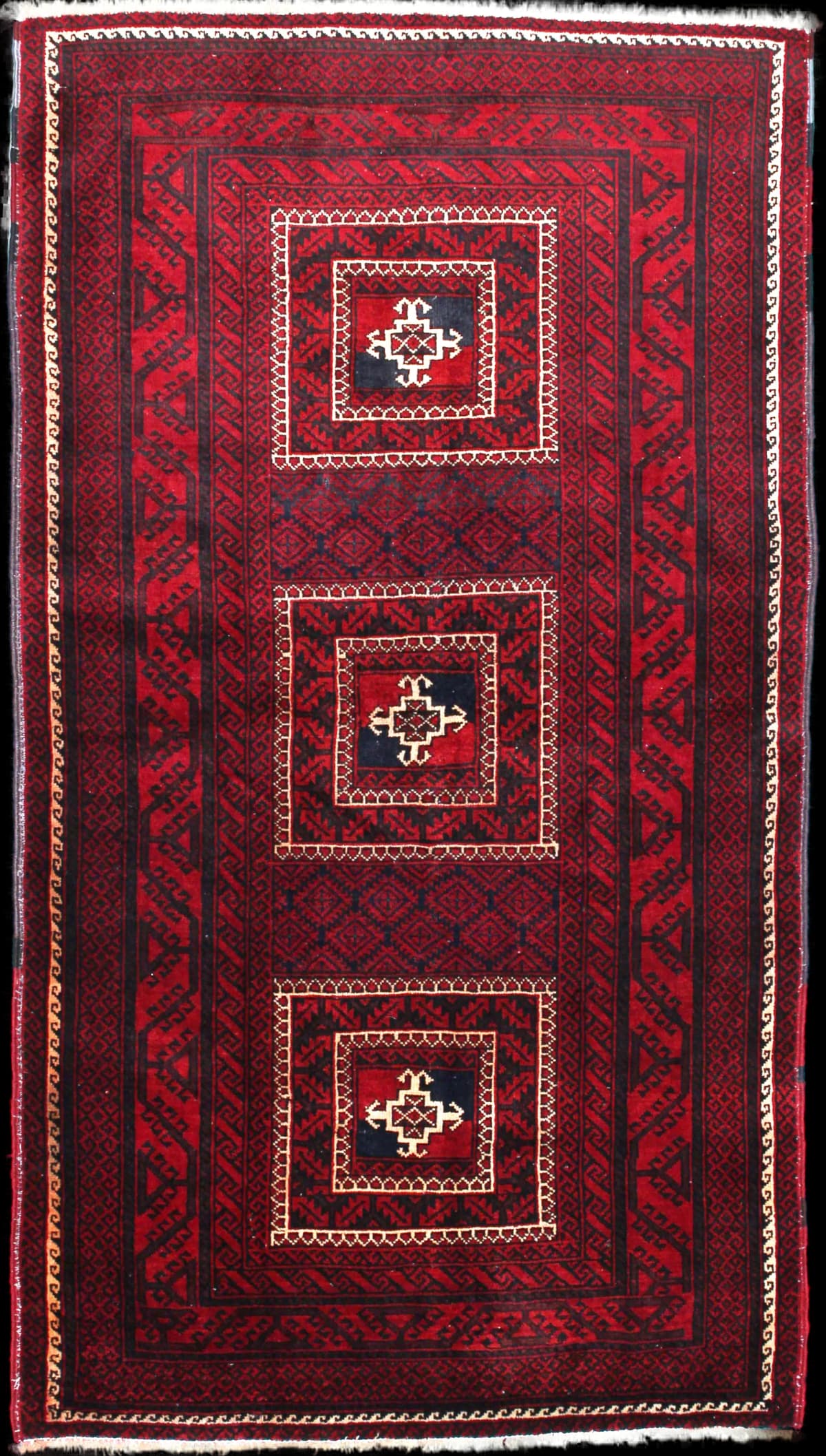 Persian rug of Baluch style in dimensions 198 centimeters length by 110 centimeters width with mainly red colors