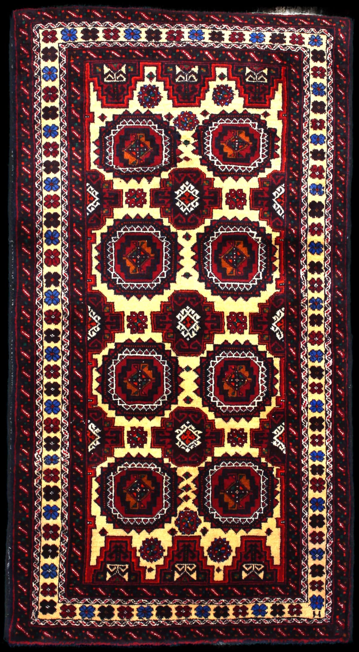 Persian rug of Baluch style in dimensions 193 centimeters length by 100 centimeters width with mainly red and orange colors