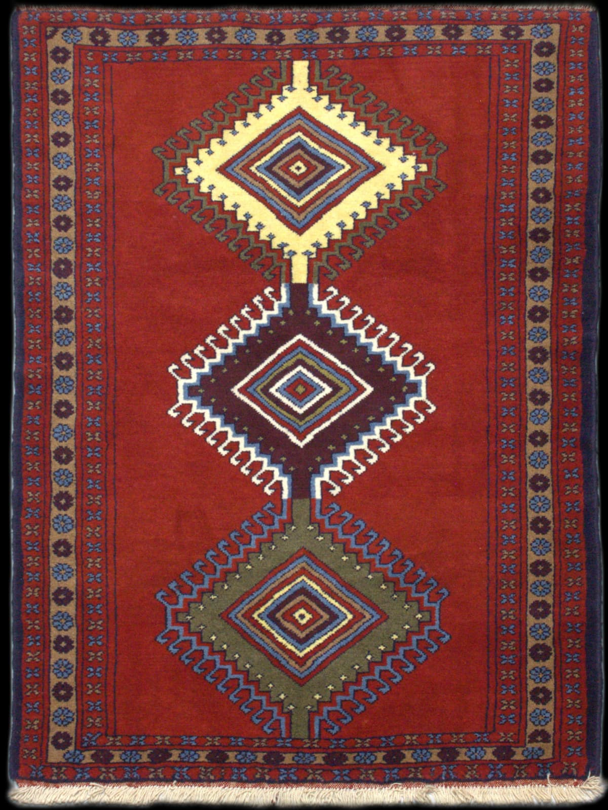 Persian rug in dimensions 170 centimeters length by 120 centimeters width with mainly red colors