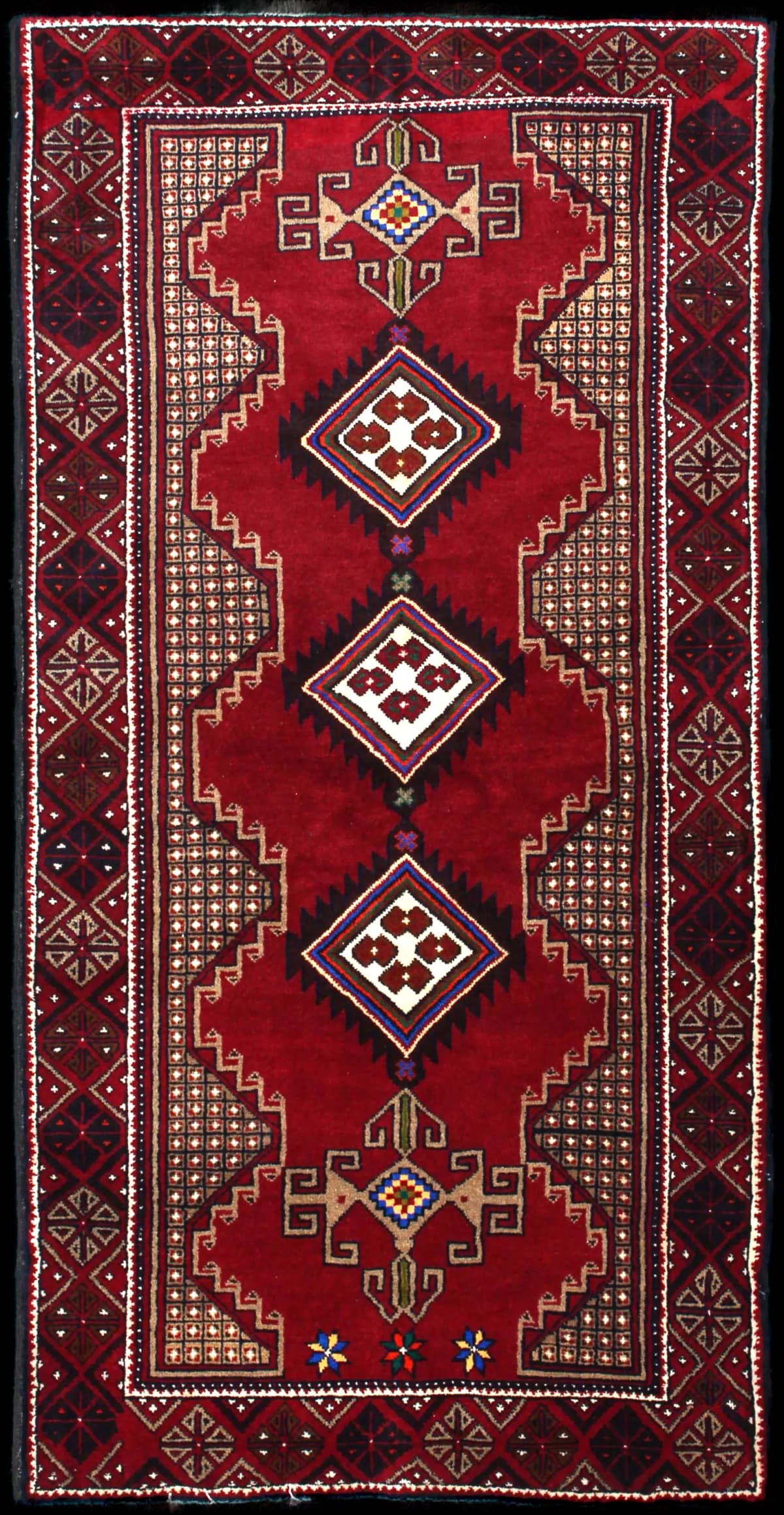 Persian rug of Baluch style in dimensions 195 centimeters length by 100 centimeters width with mainly red colors