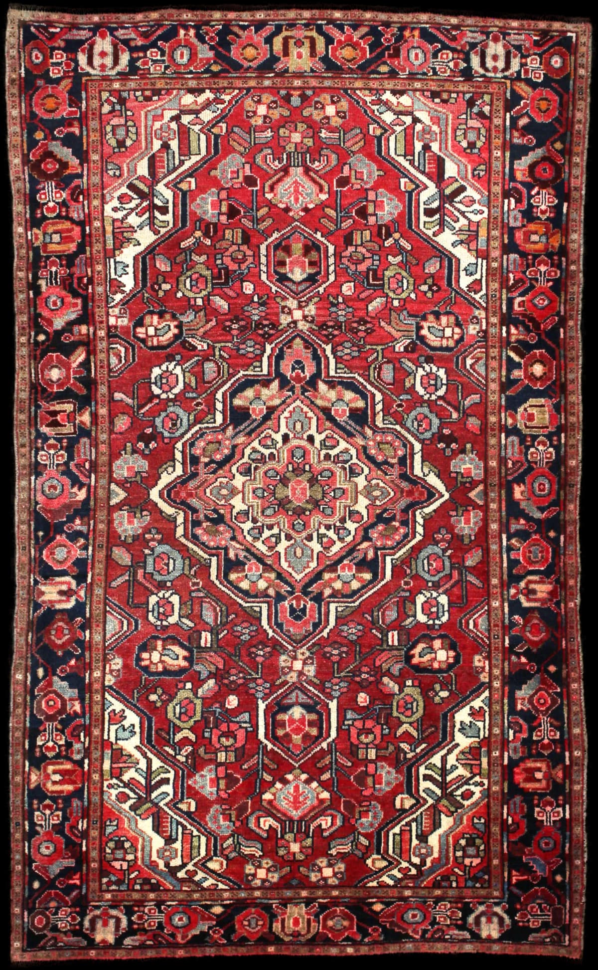Persian rug of Bakhtiari style in dimensions 202 centimeters length by 123 centimeters width with mainly red colors