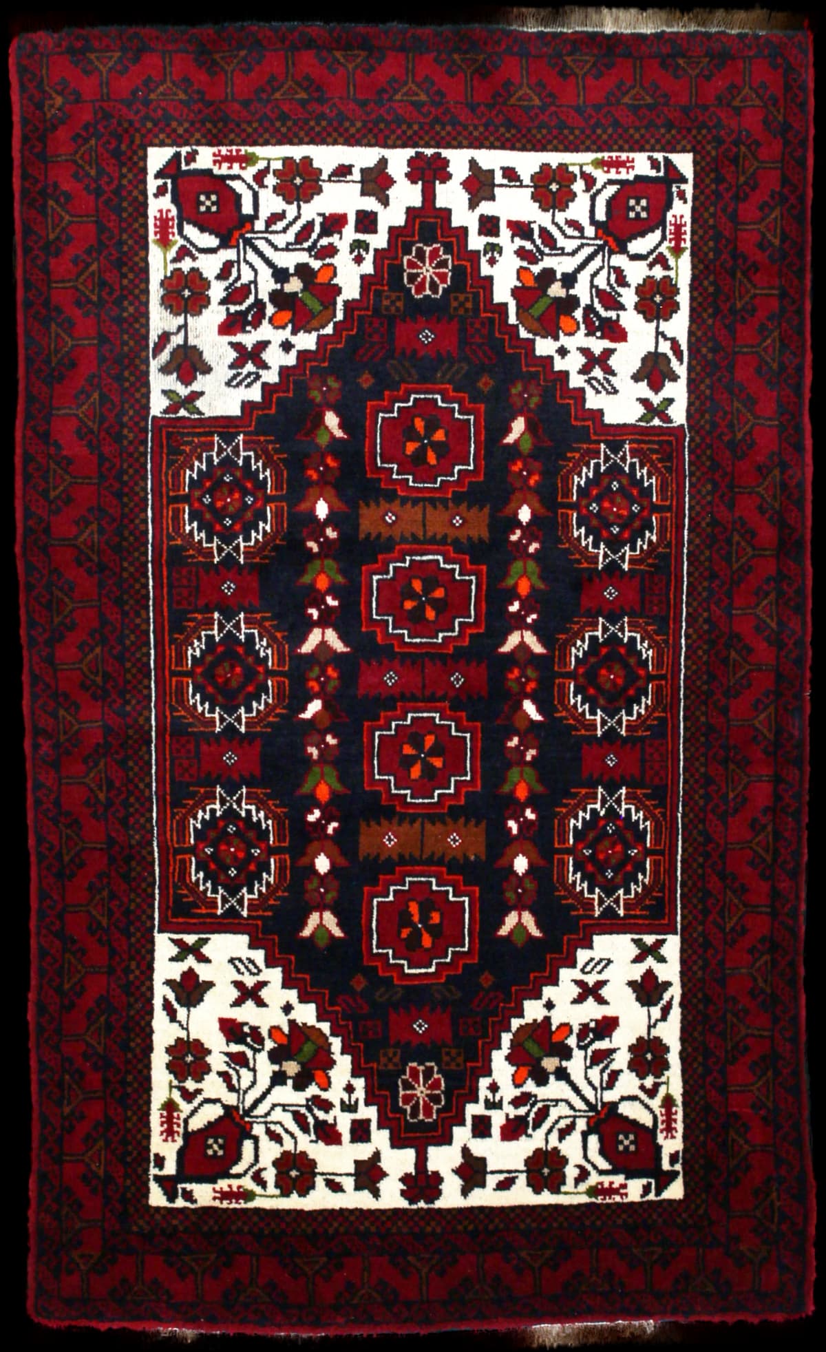 Persian rug of Baluch style in dimensions 170 centimeters length by 103 centimeters width with mainly red colors