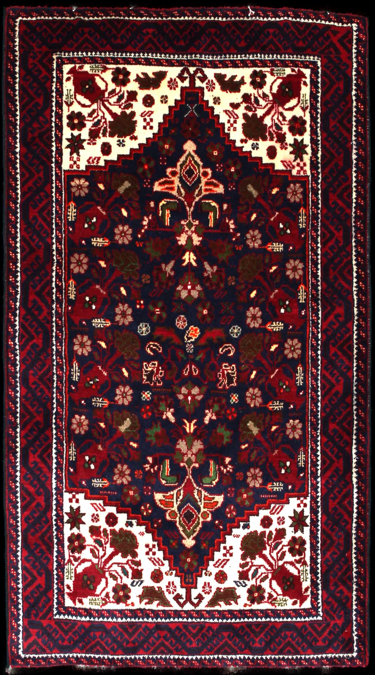 Persian rug of Baluch style in dimensions 190 centimeters length by 104 centimeters width with mainly red colors