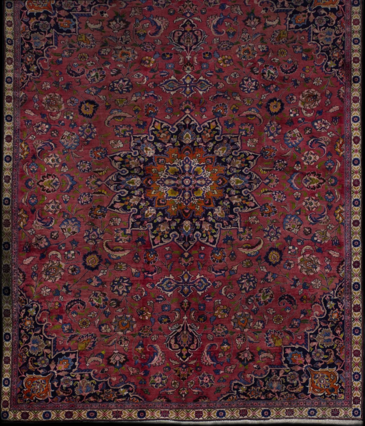 Persian rug in dimensions 315 centimeters length by 215 centimeters width with mainly pink colors
