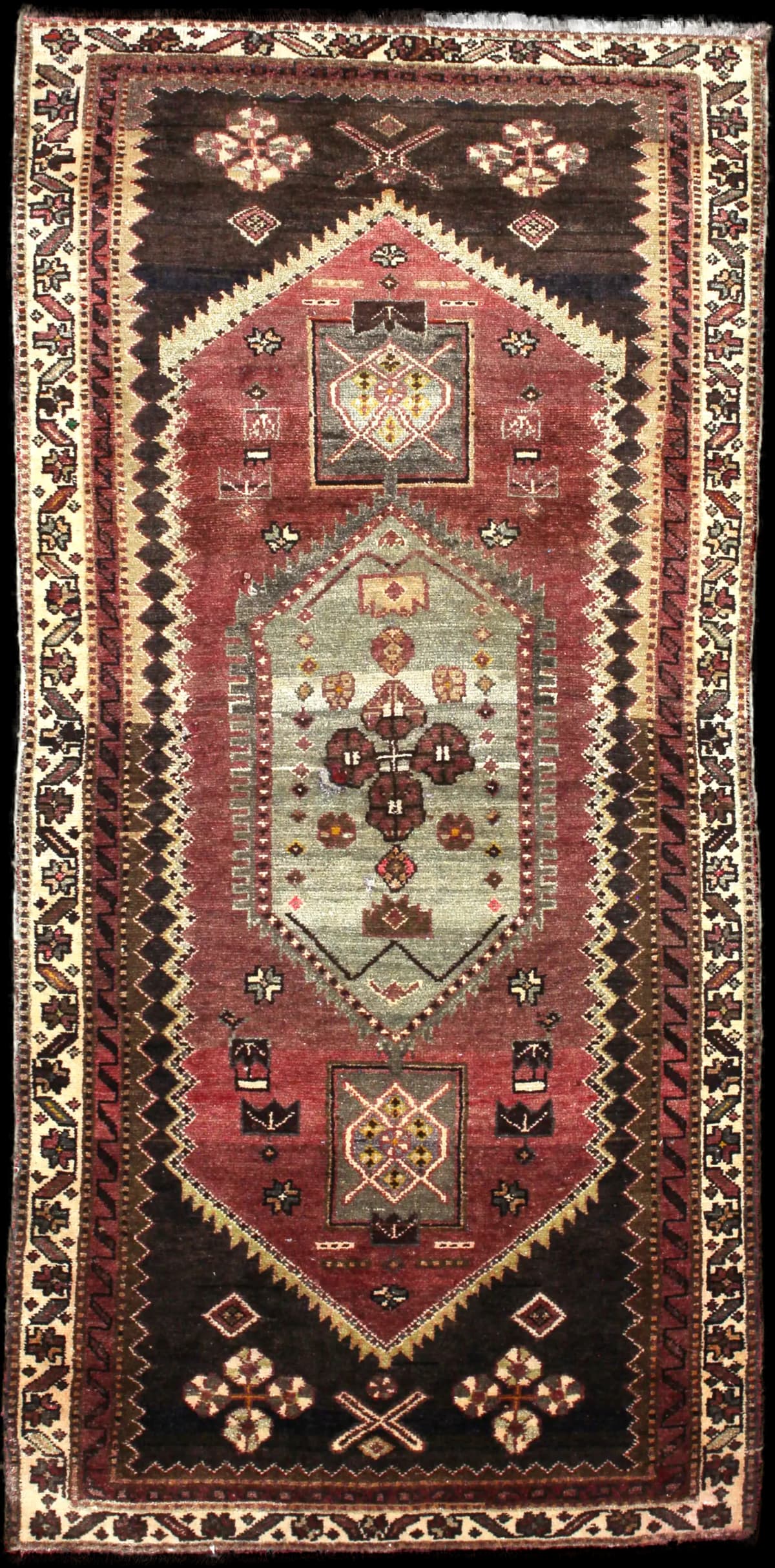 Persian rug of Zanjan style in dimensions 215 centimeters length by 100 centimeters width with mainly green and brown colors