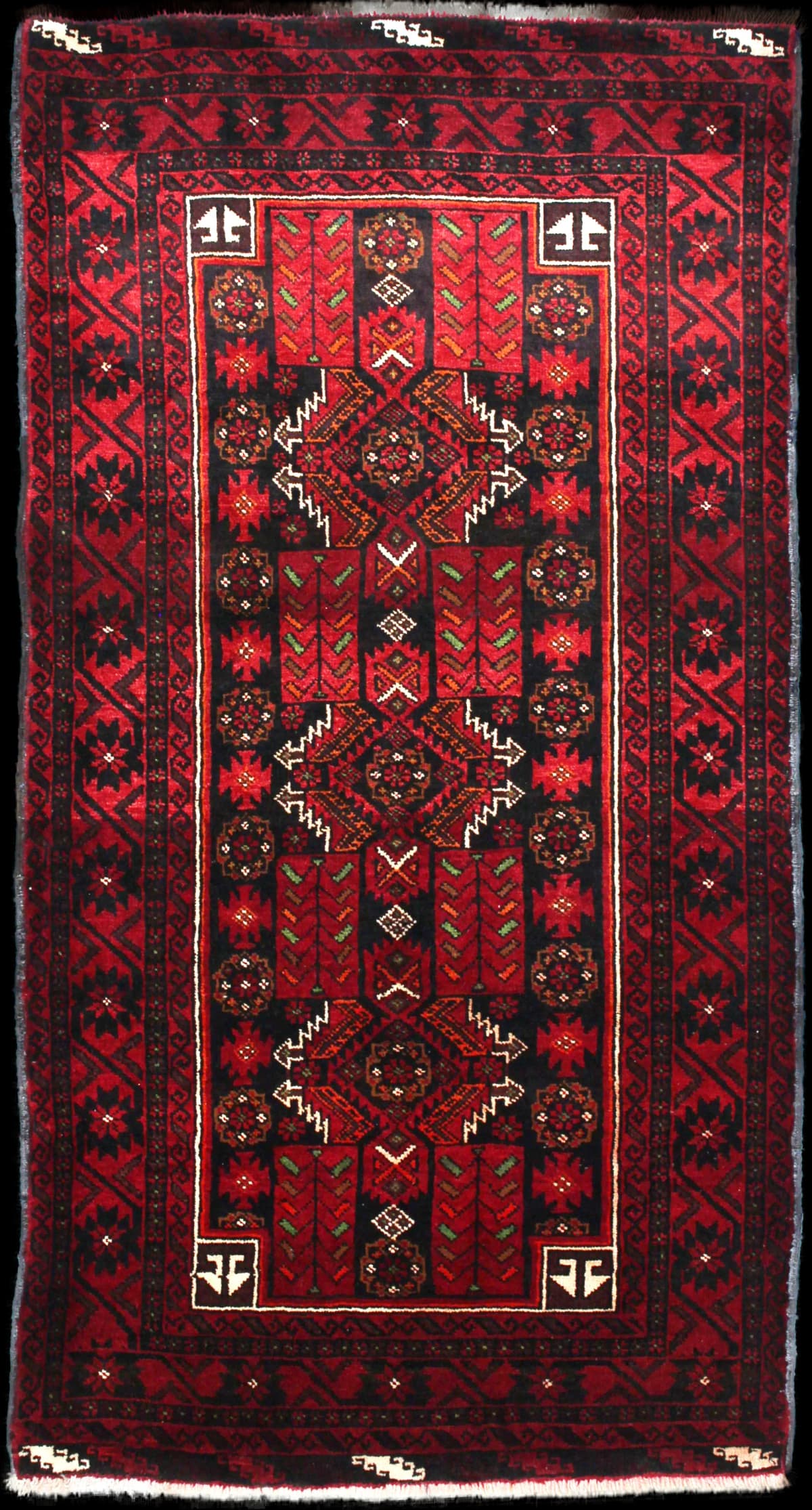 Persian rug of Baluch style in dimensions 212 centimeters length by 110 centimeters width with mainly red colors