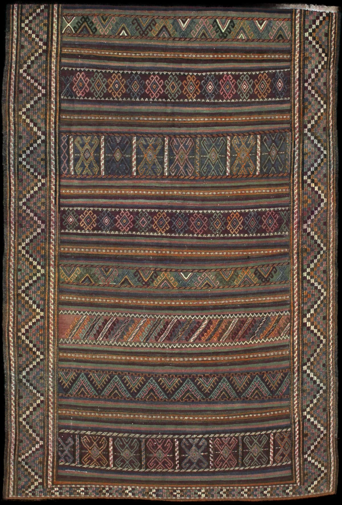 Persian rug of Sumak style in dimensions 206 centimeters length by 141 centimeters width with mainly green and purple colors