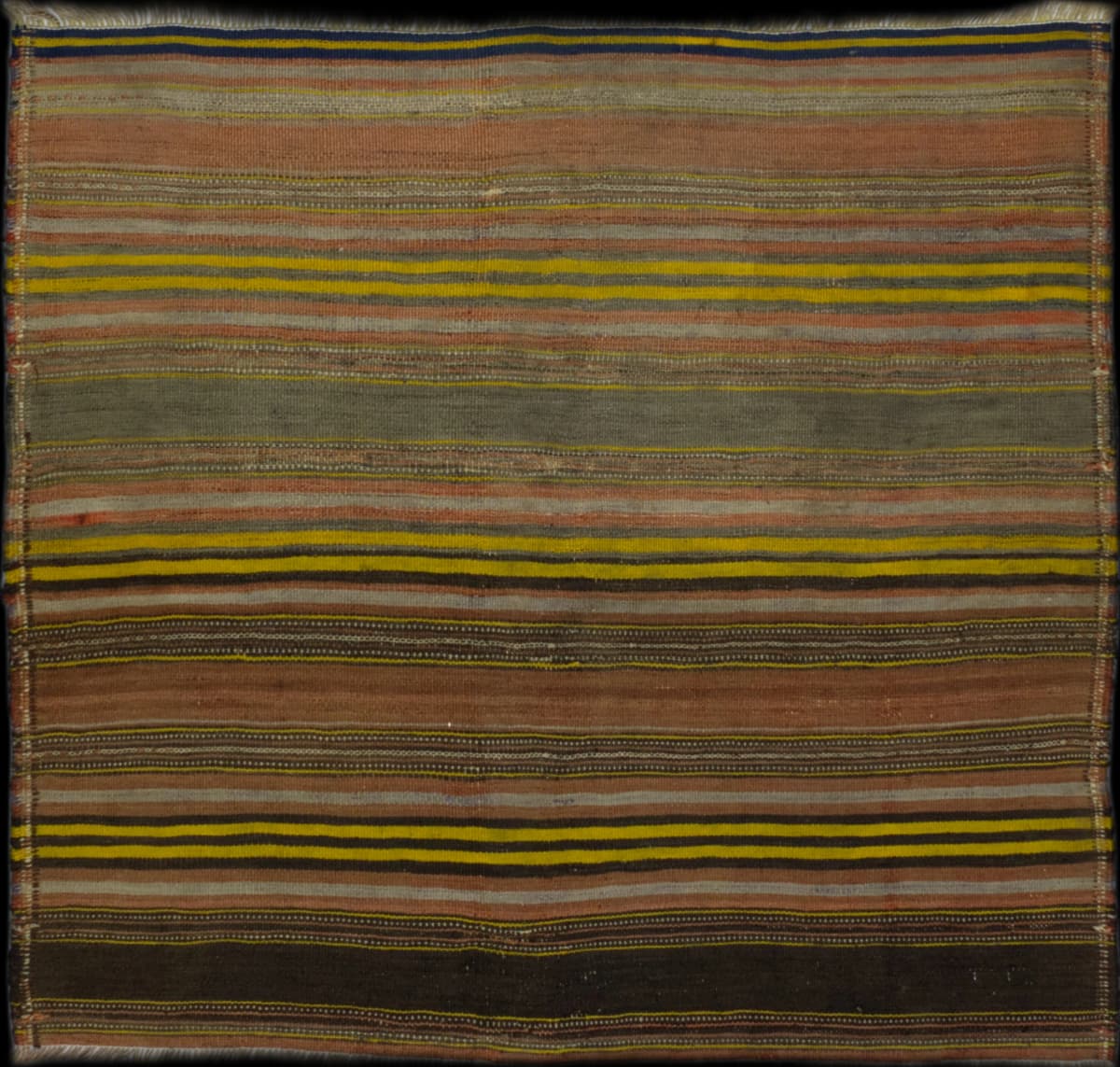 Persian rug of Sumak Kilim style in dimensions 143 centimeters length by 132 centimeters width with mainly yellow and brown colors