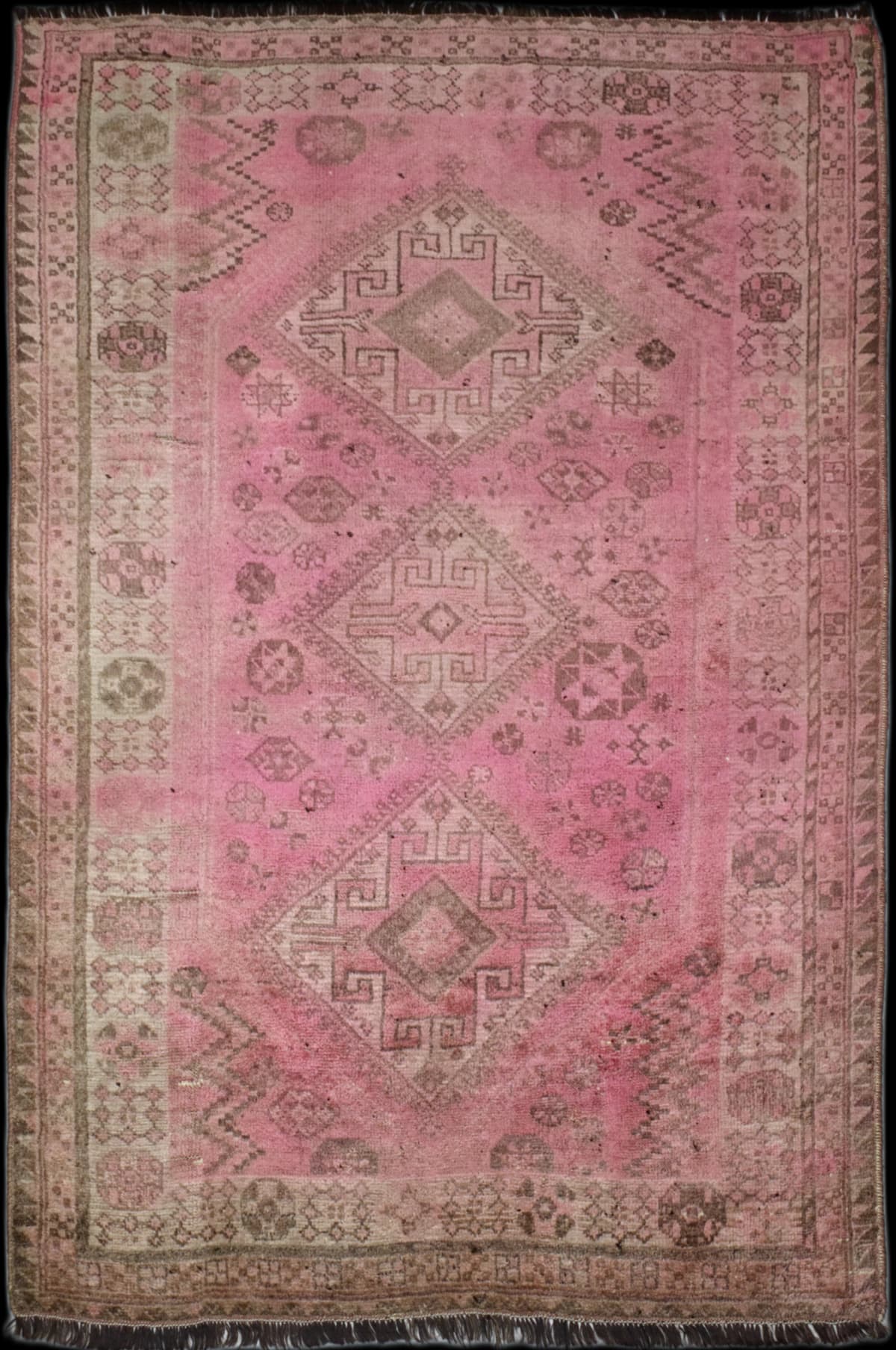 Persian rug in dimensions 245 centimeters length by 150 centimeters width with mainly pink colors