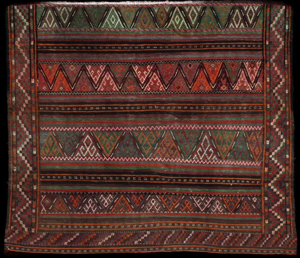 Persian rug of Sumak style in dimensions 155 centimeters length by 135 centimeters width with mainly green and brown colors