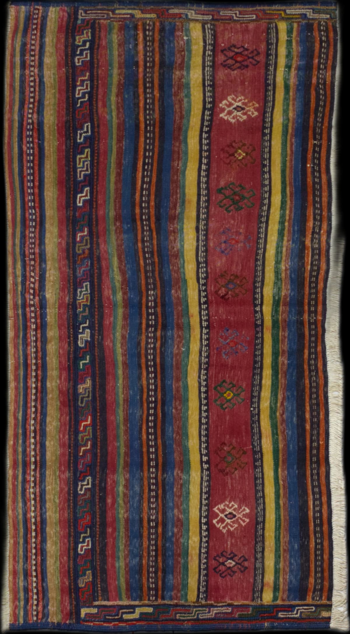 Persian rug in dimensions 180 centimeters length by 81 centimeters width with mainly red colors