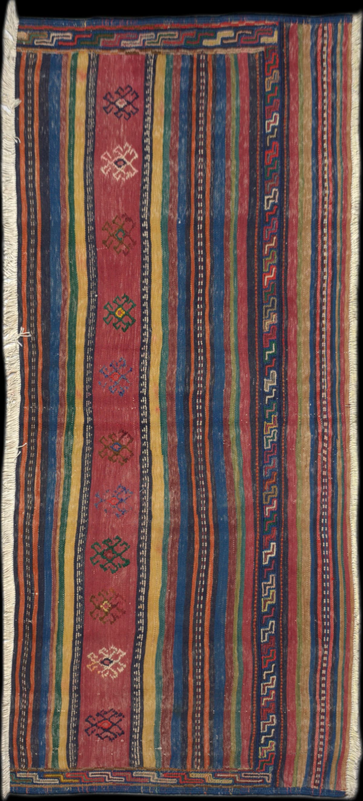 Persian rug of Sumak style in dimensions 180 centimeters length by 81 centimeters width with mainly red colors