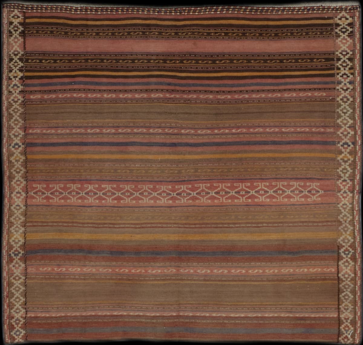 Persian rug of Sumak Kilim style in dimensions 144 centimeters length by 135 centimeters width with mainly brown and pink colors