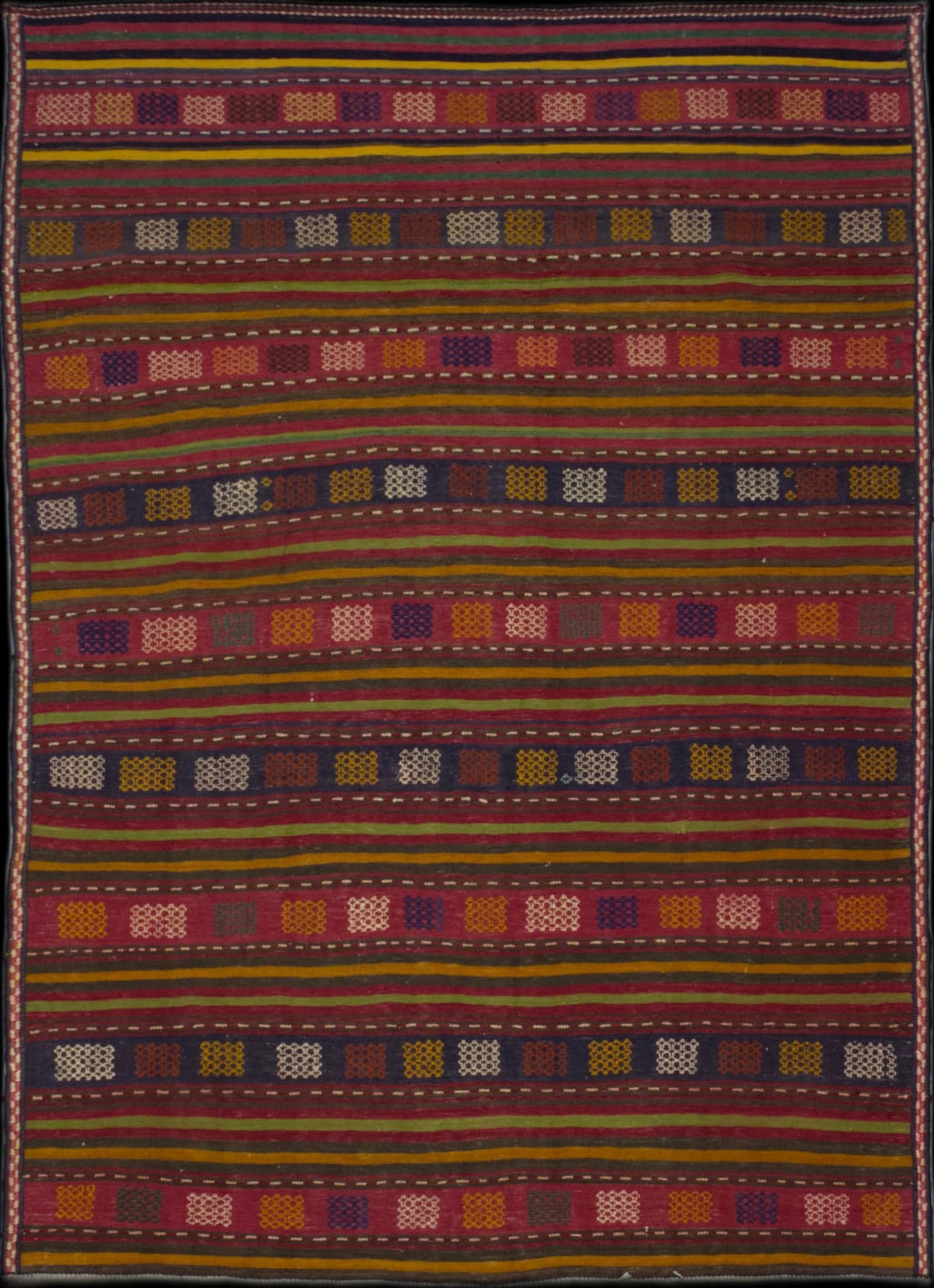 Persian rug in dimensions 210 centimeters length by 141 centimeters width with mainly red colors
