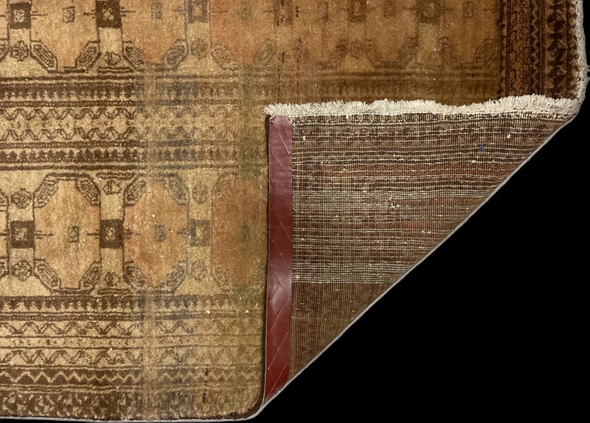 Perserteppich Belutsch, 94x182 cm, überwiegend in Braun — Gefaltet