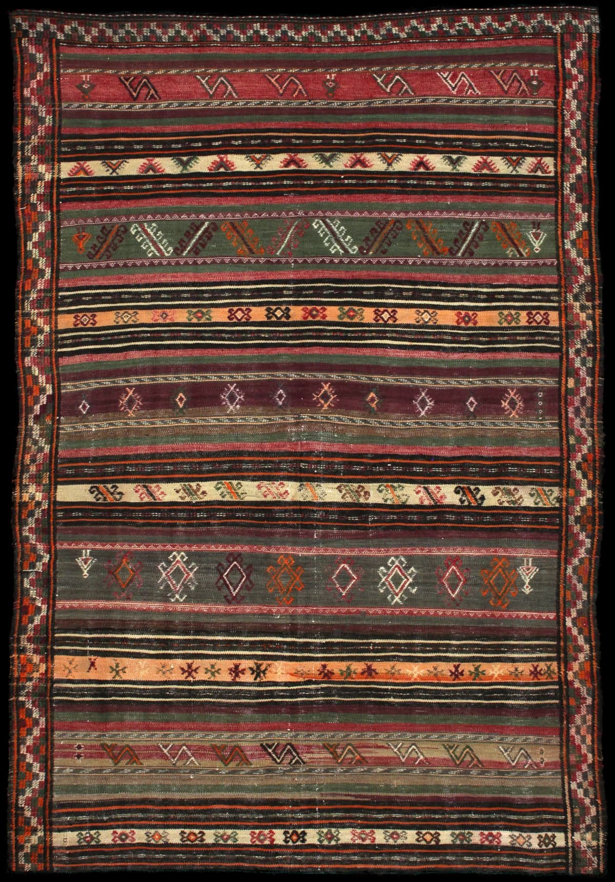Persian rug of Sumak style in dimensions 212 centimeters length by 146 centimeters width with mainly red and green colors