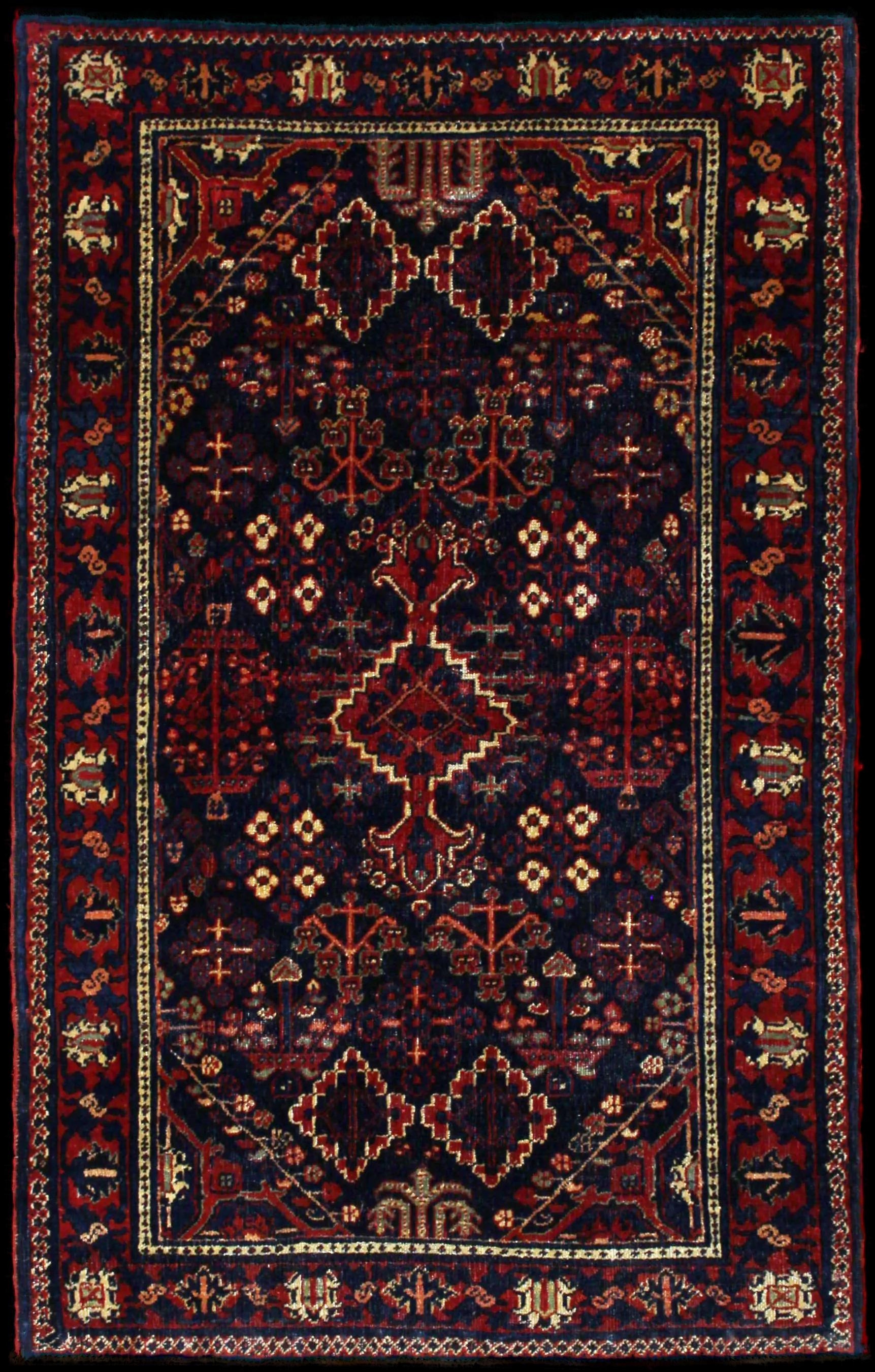 Handmade Persian rug in dimensions 157 centimeters length by 100 centimeters width with mainly Red and Blue colors