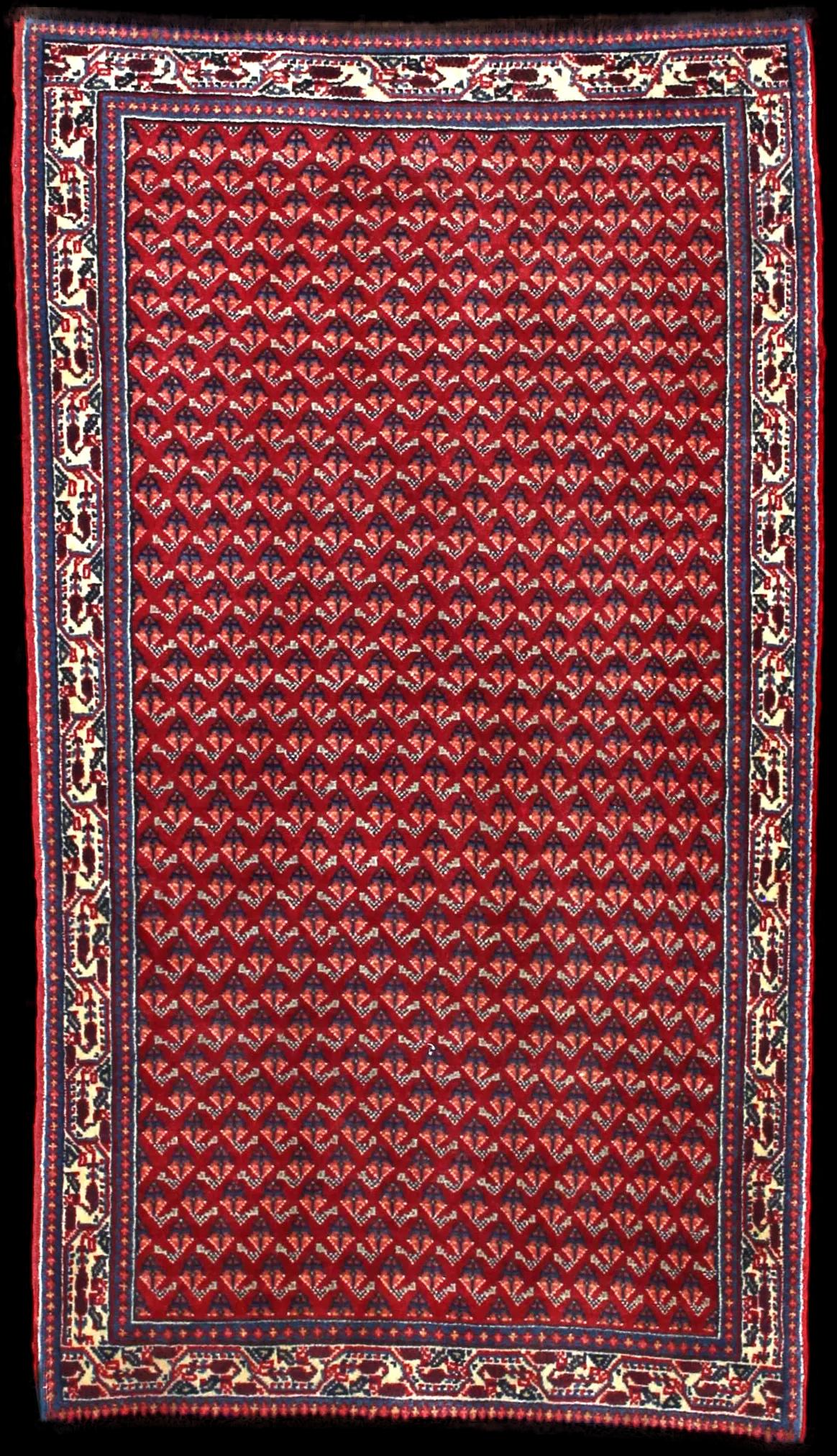 Handmade Persa rug in dimensions 115 centimeters length by 67 centimeters width with mainly Rojo y Azul colors