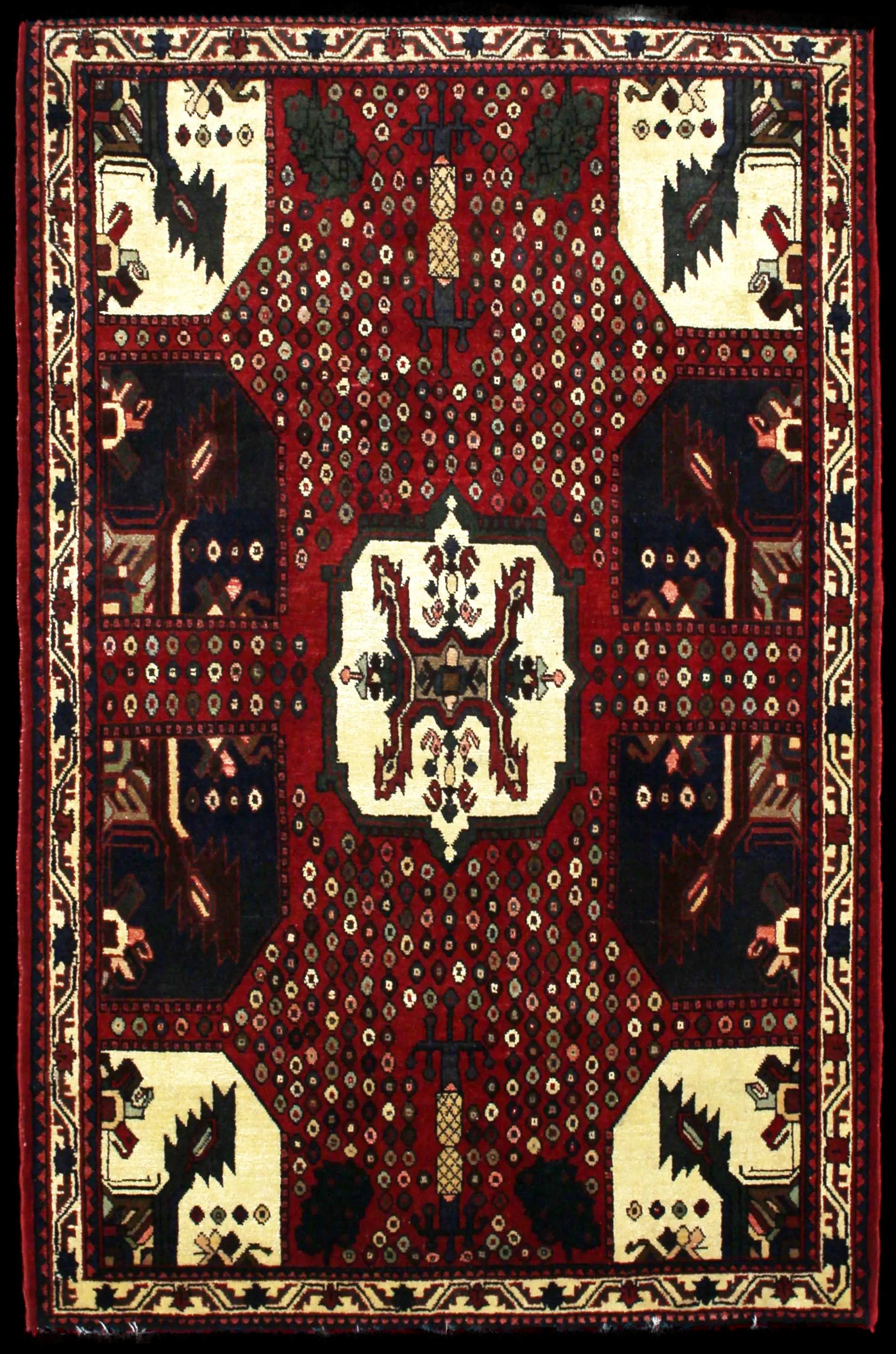 Handmade Persian rug in dimensions 162 centimeters length by 107 centimetres width with mainly Red colors